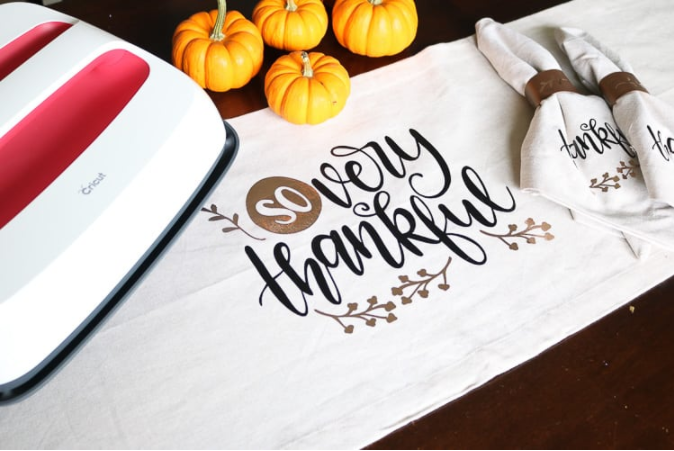 Thanksgiving Table Runner that says So very thankful and has a few leaves and branches on it
