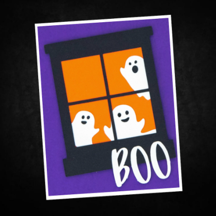 Halloween Card showing ghosts in a window with the word Boo