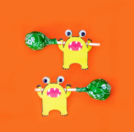 Halloween Monster Lollipop Holders - little yellow monsters with googly eyes, hands will hold a lollipop