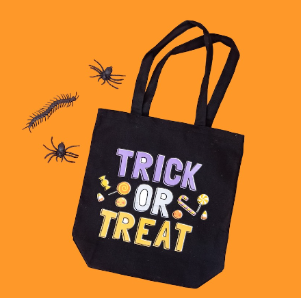 Trick Or Treat Bag with the words trick or treat and some candy pieces