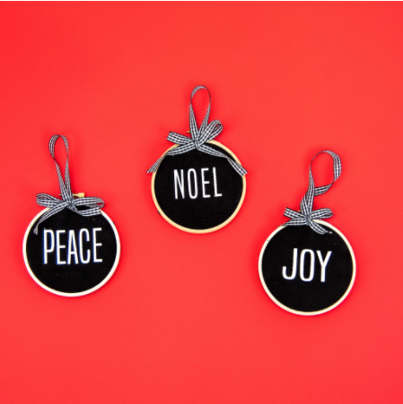 Diy round Chalkboard Christmas Ornaments with text saying Peace, Noel, and Joy