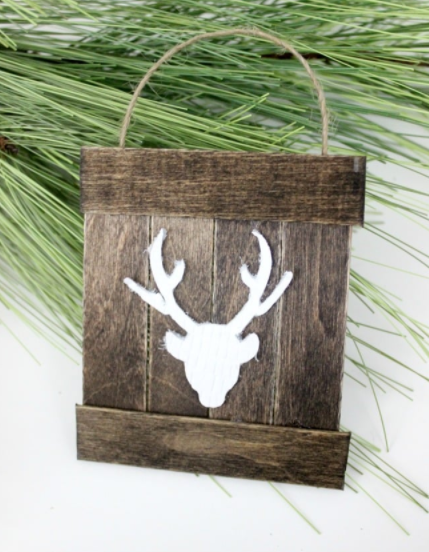Mini Pallet Ornaments with a white deer on them