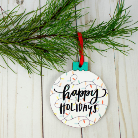 Print Then Cut Christmas Ornament - retro Christmas ball shape with strings of lights background design and words Happy Holidays