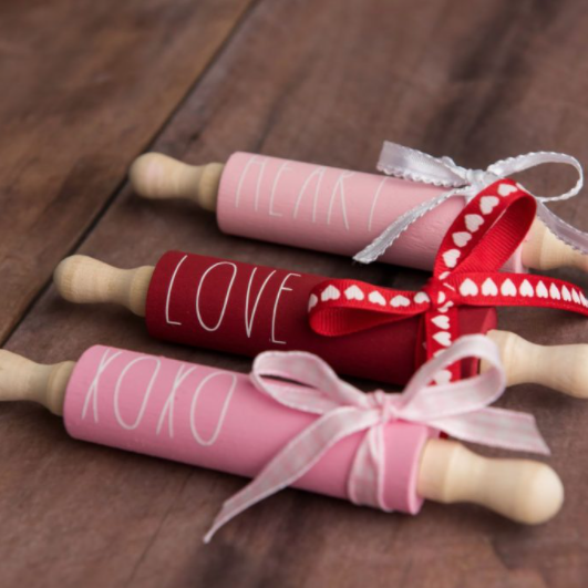 Mini Farmhouse Rolling Pins painted red and pink saying "heart", "love", and "xoxo"