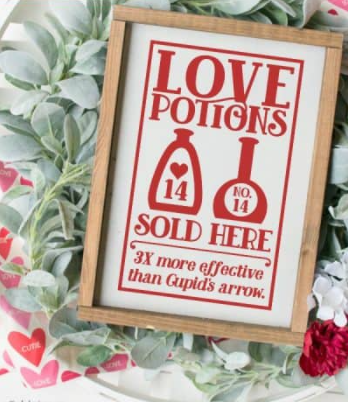 Farmhouse style sign with love potion bottles on it saying Love potions sold here, 3X more effective than cupid's arrow