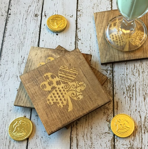 Diy Stained St. Patricks Coasters with gold shamrocks on them