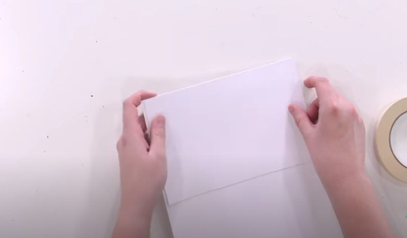 Taping Leftover Paper To A Piece Of Sturdy Cardstock