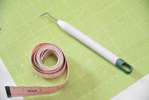 weeding tool with measuring tape